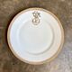 Gold monogrammed porcelain plate "F"