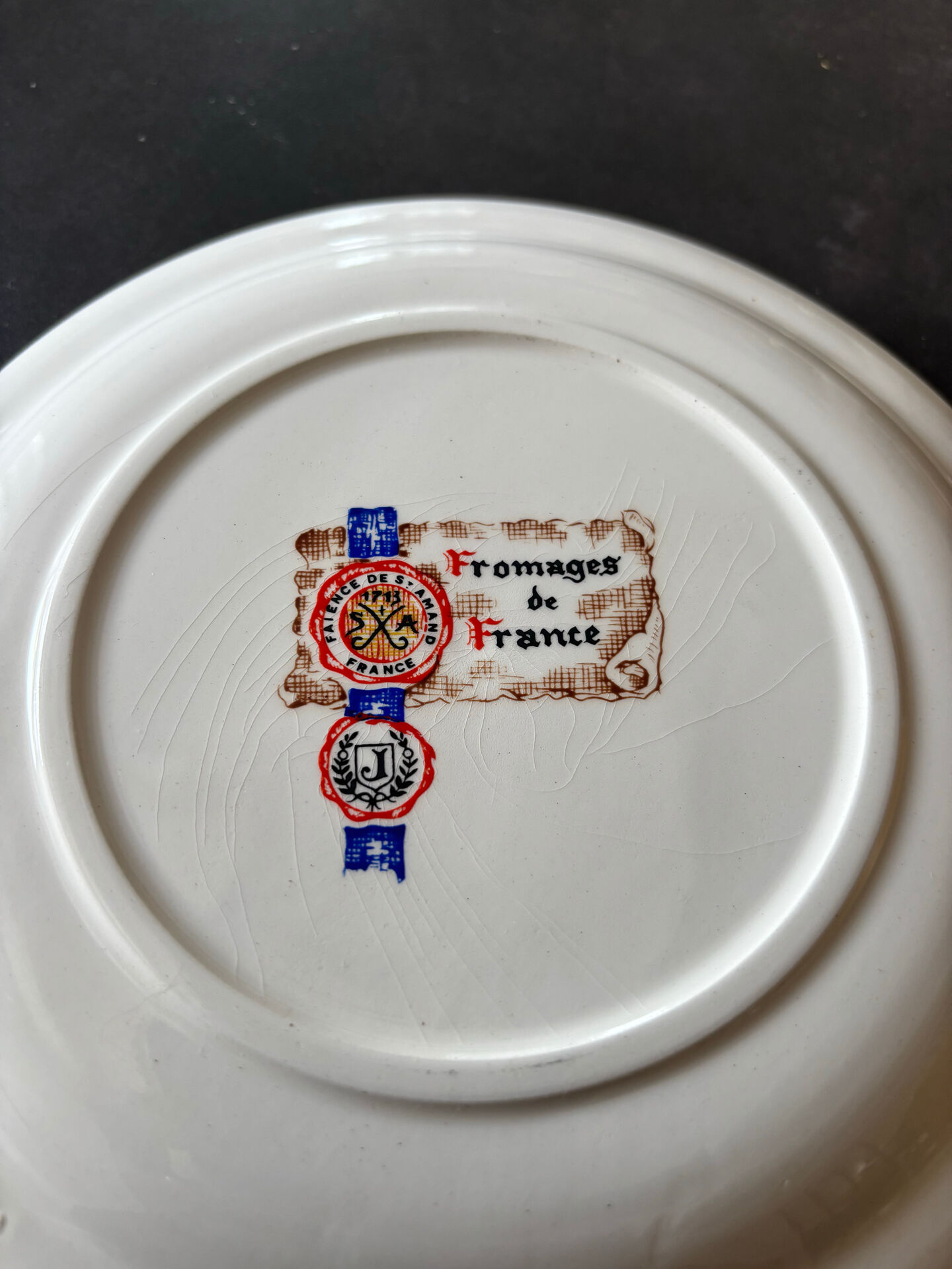 6 ceramic cheese plates from St Armand, France, in their box.