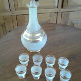 8 glasses and bottle with cap