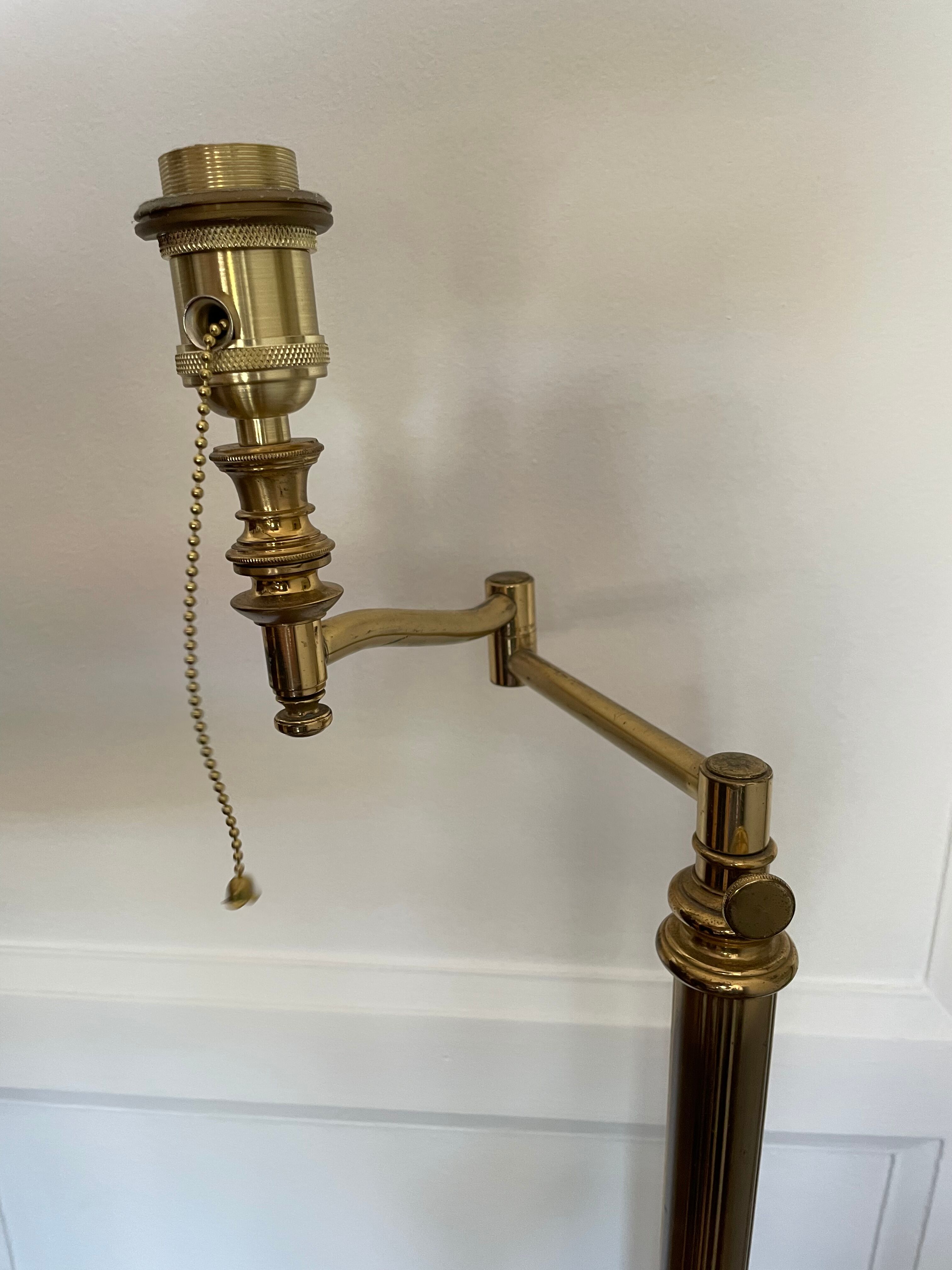 Articulated brass and gold metal floor lamp