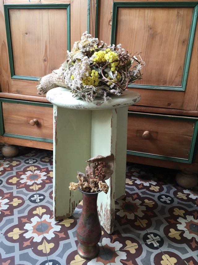 A rough wooden stool patinated by time