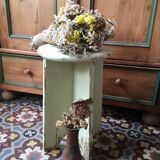 A rough wooden stool patinated by time