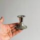 Pair of small light metal candlesticks