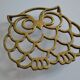 Vintage openwork brass trivet in the shape of an owl or owl