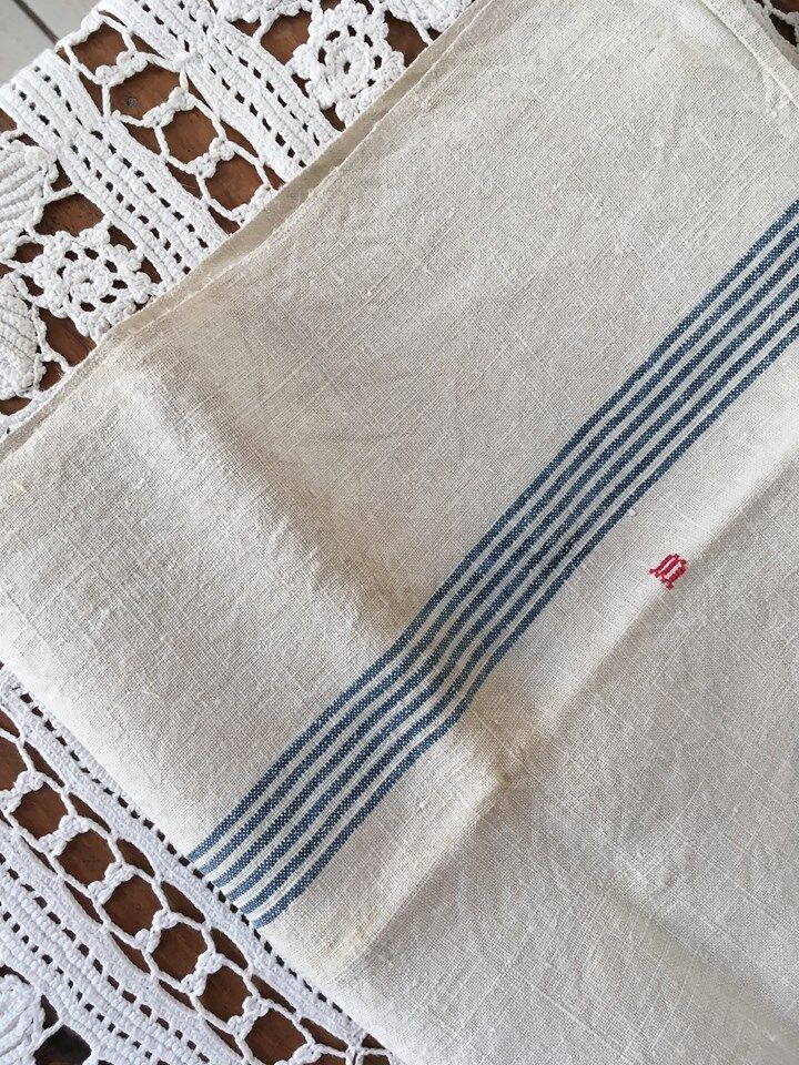 Pair of old dishcloths at marked blue stripes m.