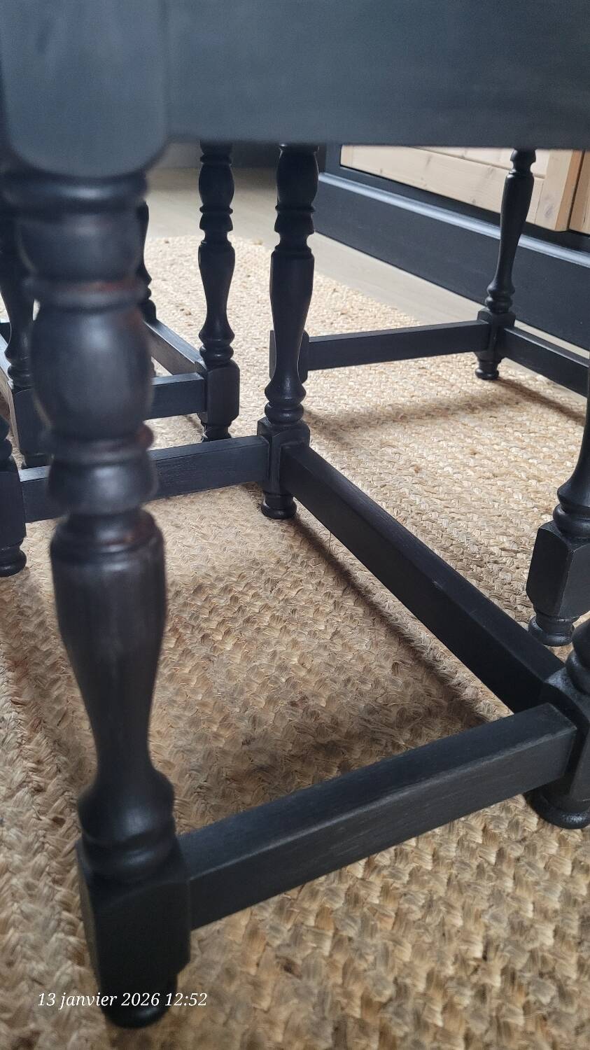 Nest tables in wood and black.