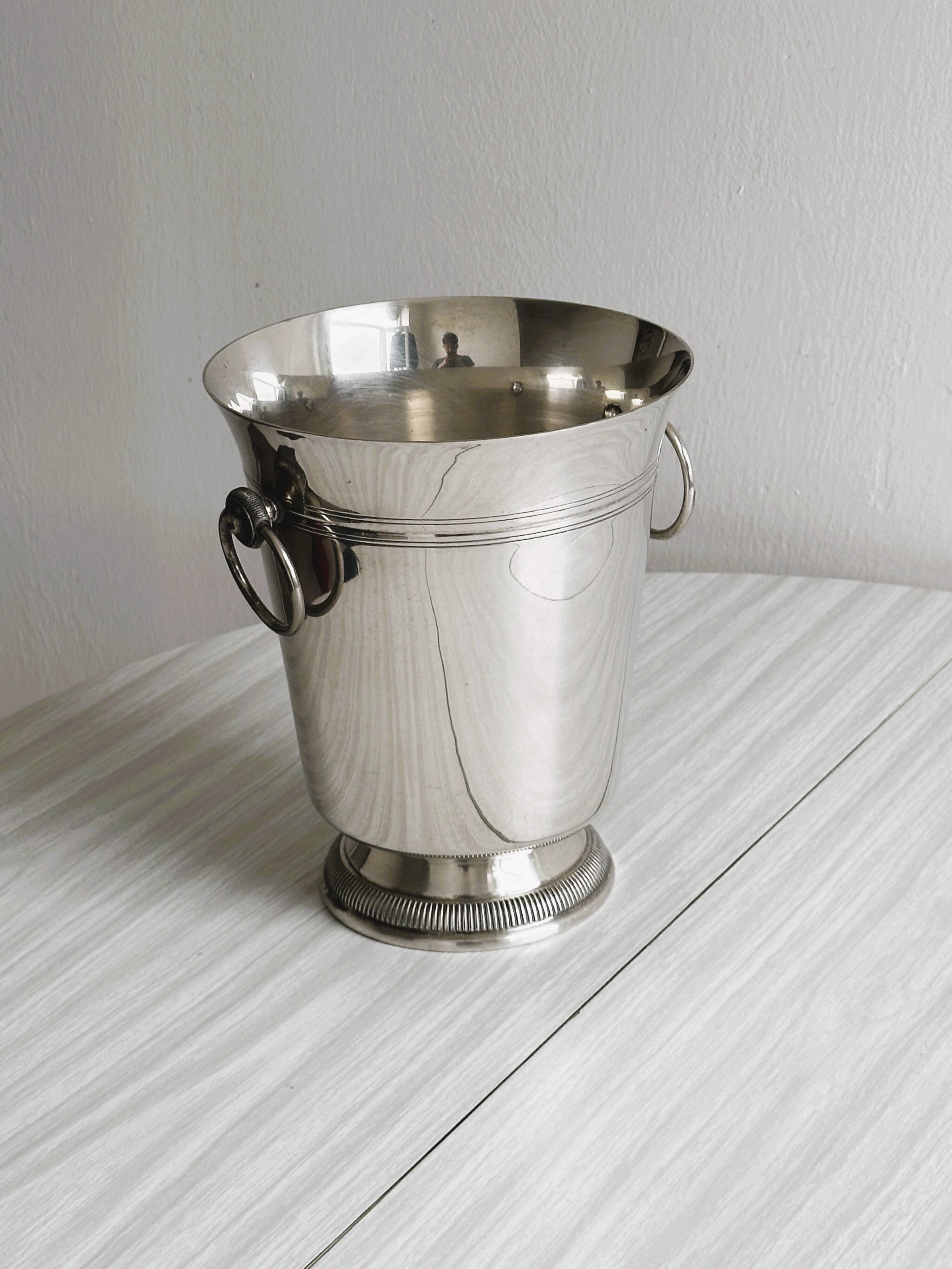 Antique champagne bucket in shiny silver metal