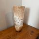 Large hand-blown glass vase in brown and beige.