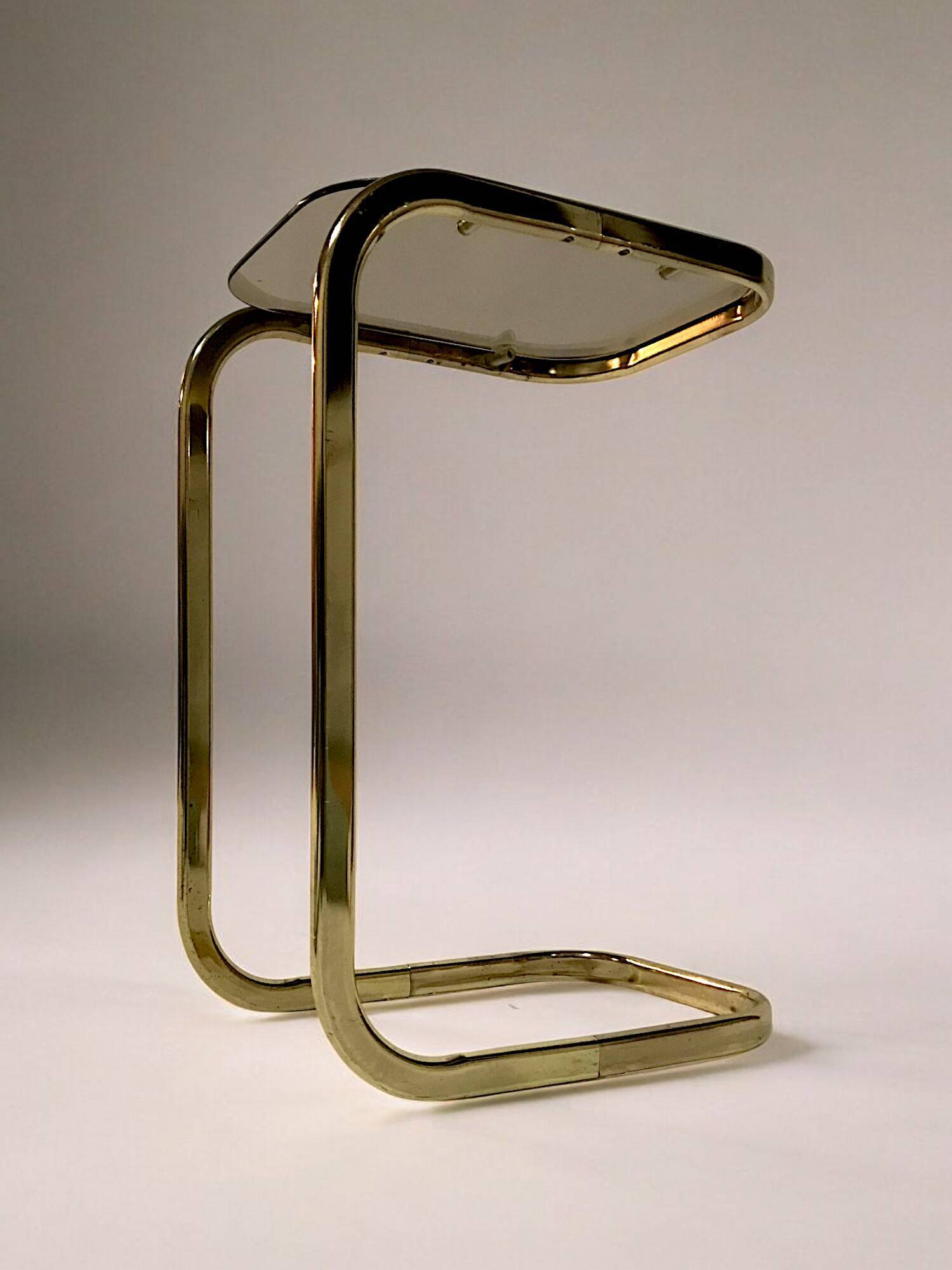 C. 1970 - Pair of side tables in gilded metal and smoked glass -