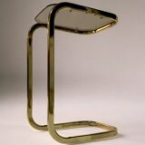 C. 1970 - Pair of side tables in gilded metal and smoked glass -
