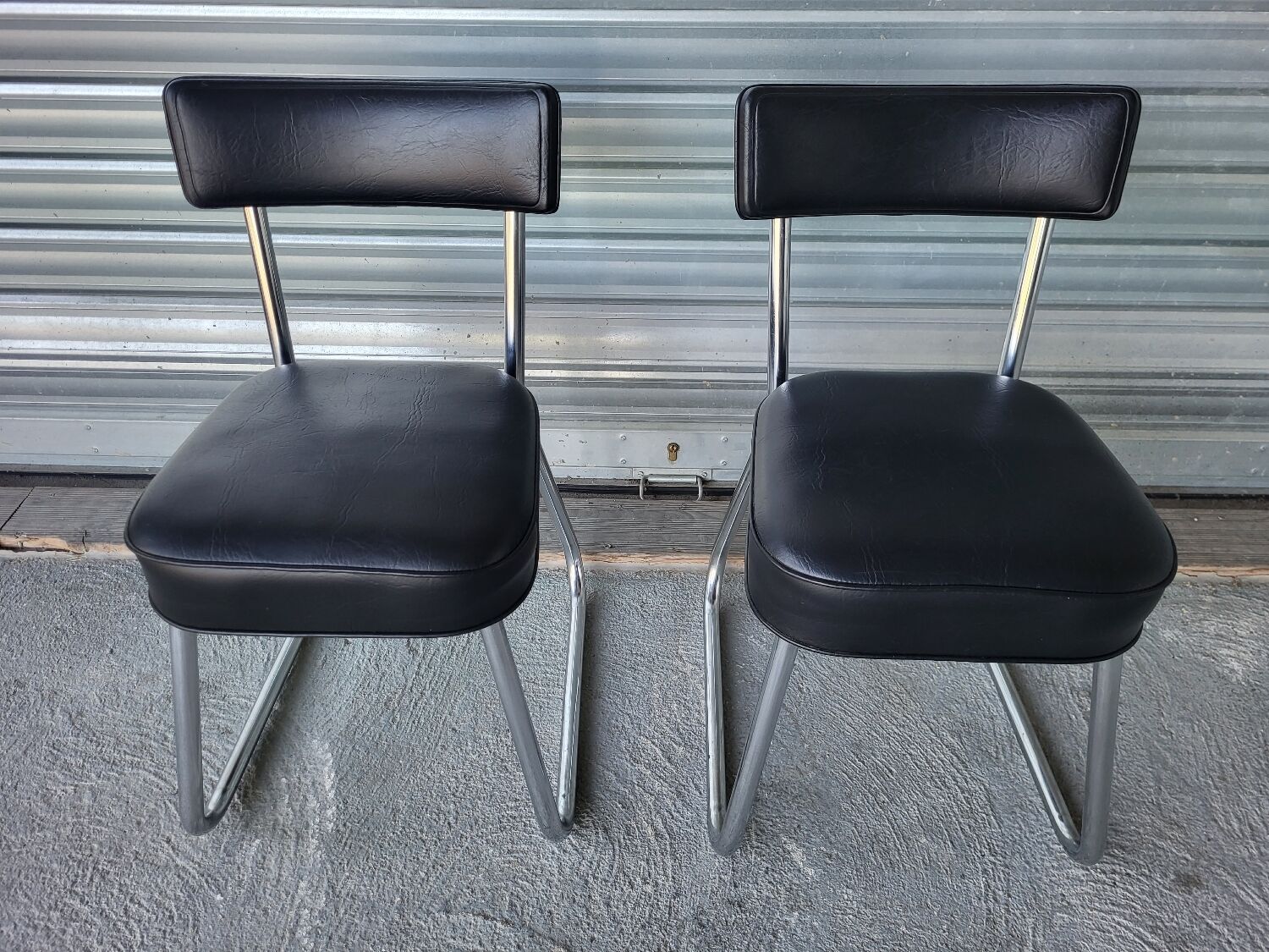 Pair of vintage black and chrome leatherette office chairs in very good condition