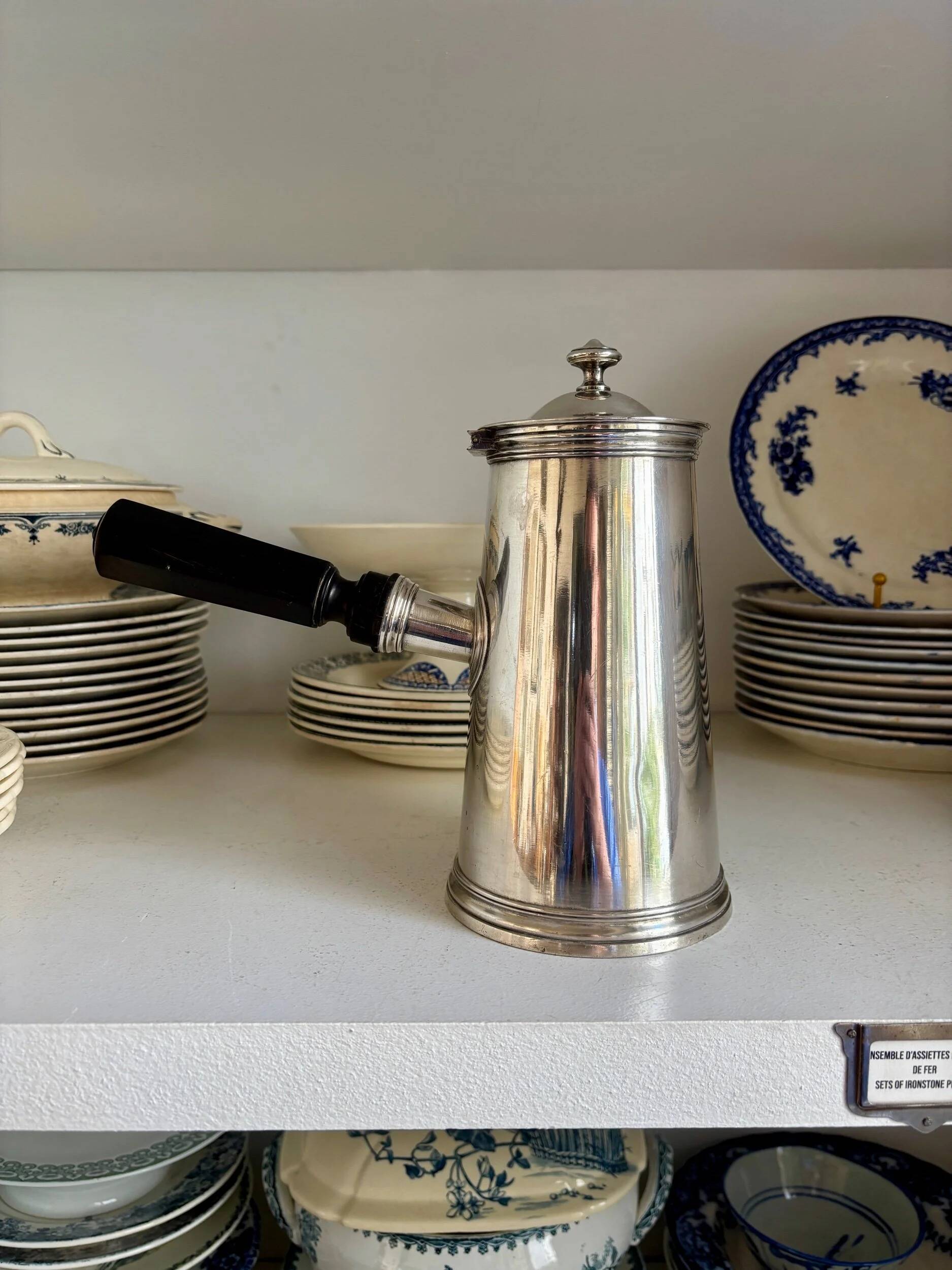 Christofle silver-plated chocolate pot and coffee pot with a blackened wooden handle.