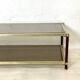 Vintage 1970s gold metal and smoked glass coffee table.