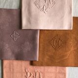 Set of four old damask towels dyed in multiple colors