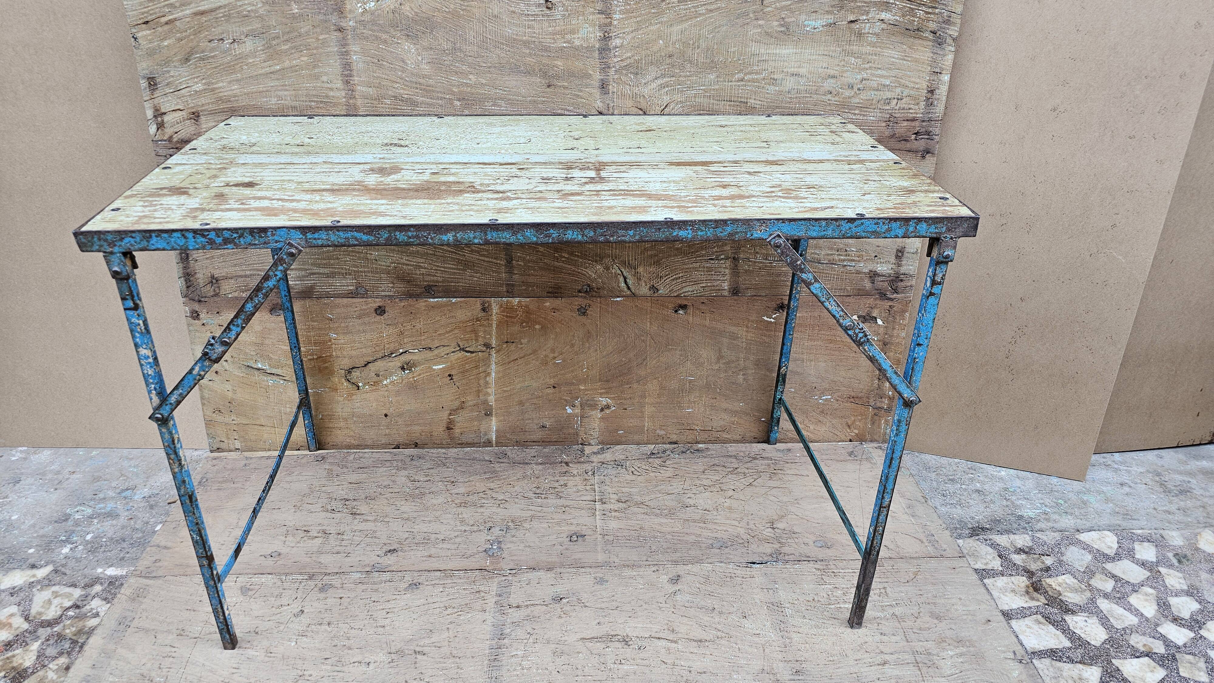 Old folding table in Burmese teak and steel