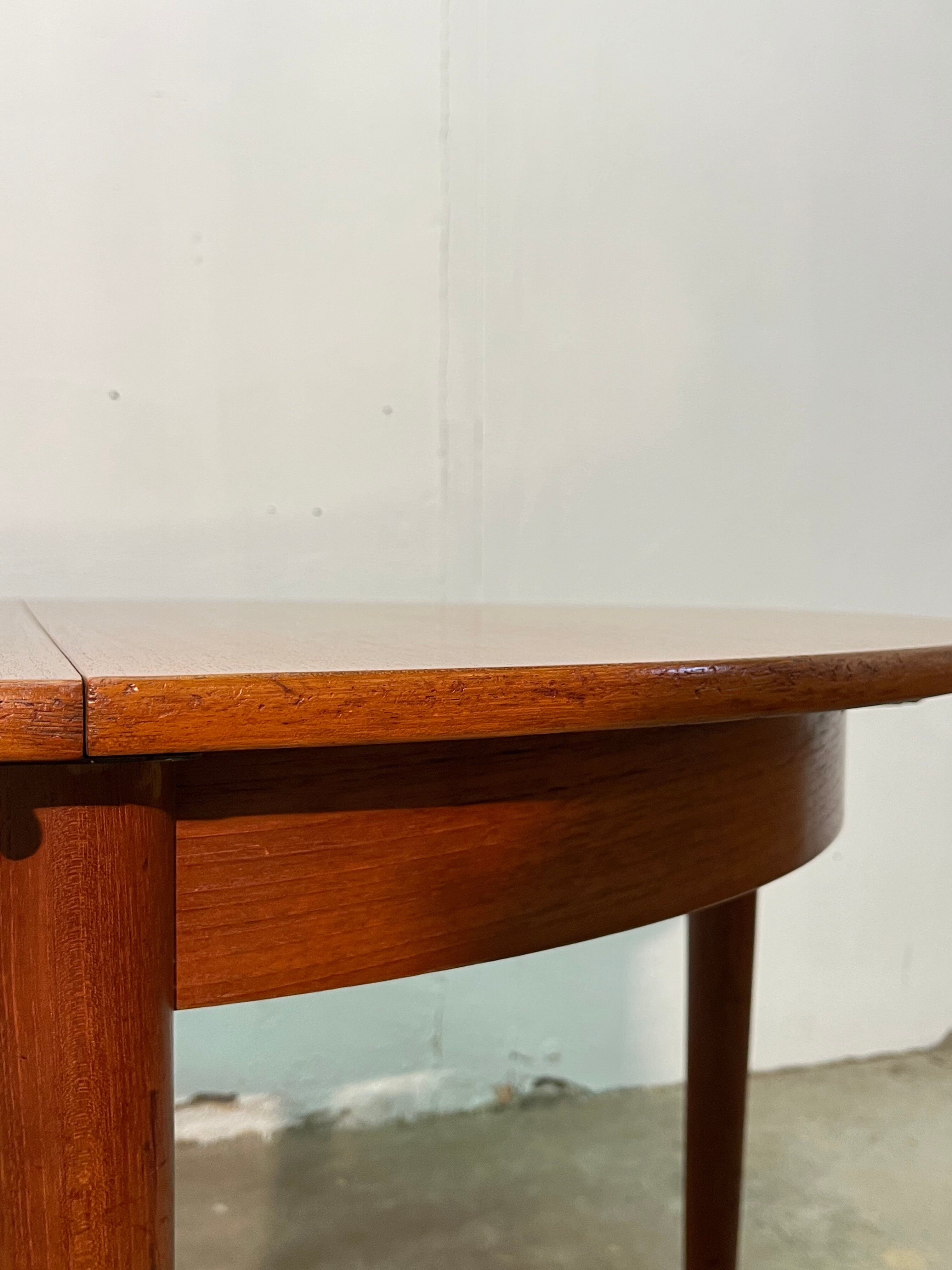 Vintage 1960s teak extendable Scandinavian table.
