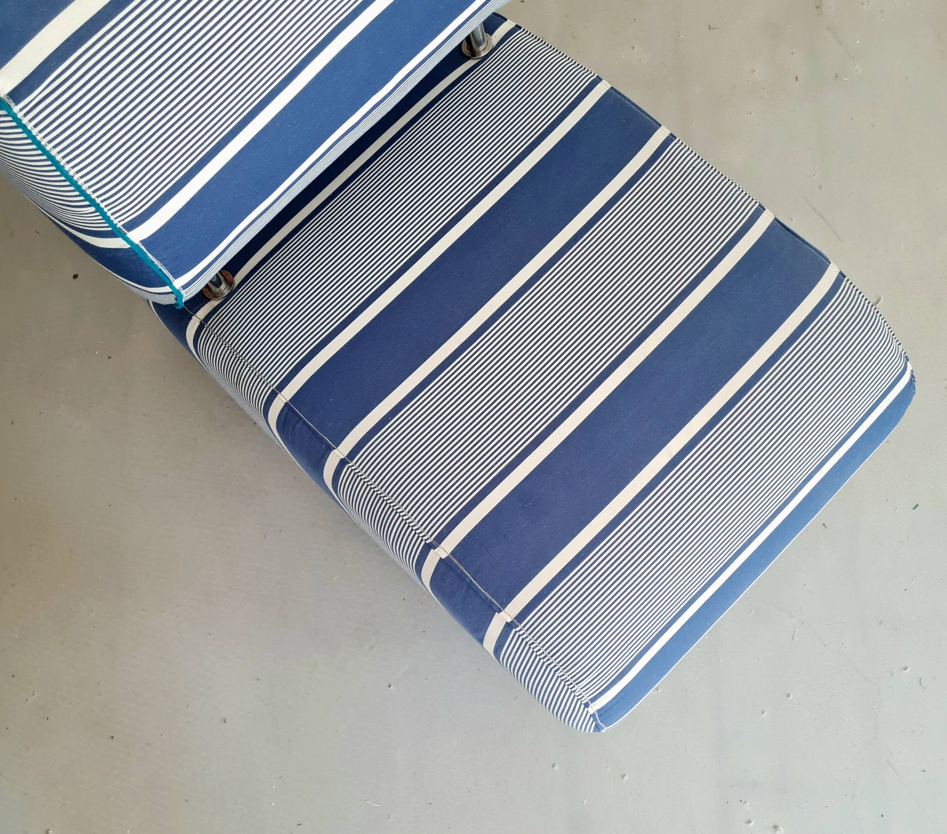 Curved armchair with blue and white stripes