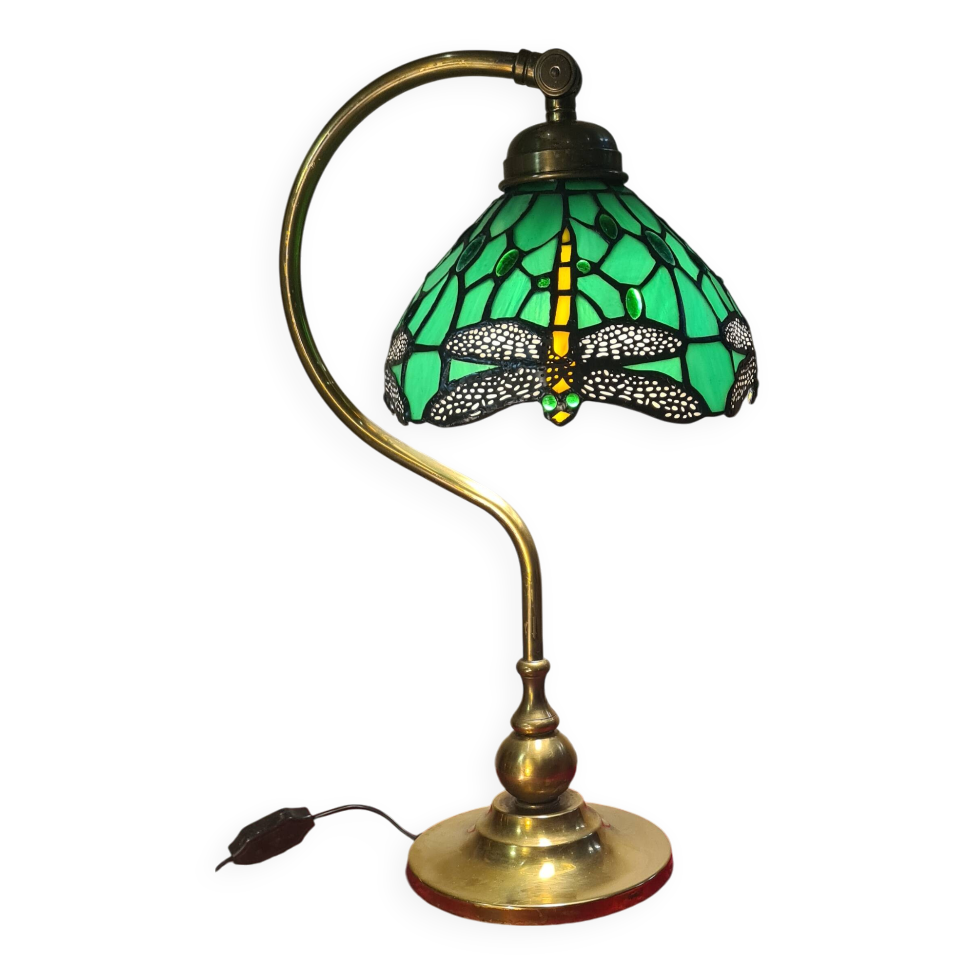 brass lamp with green stained glass shade.