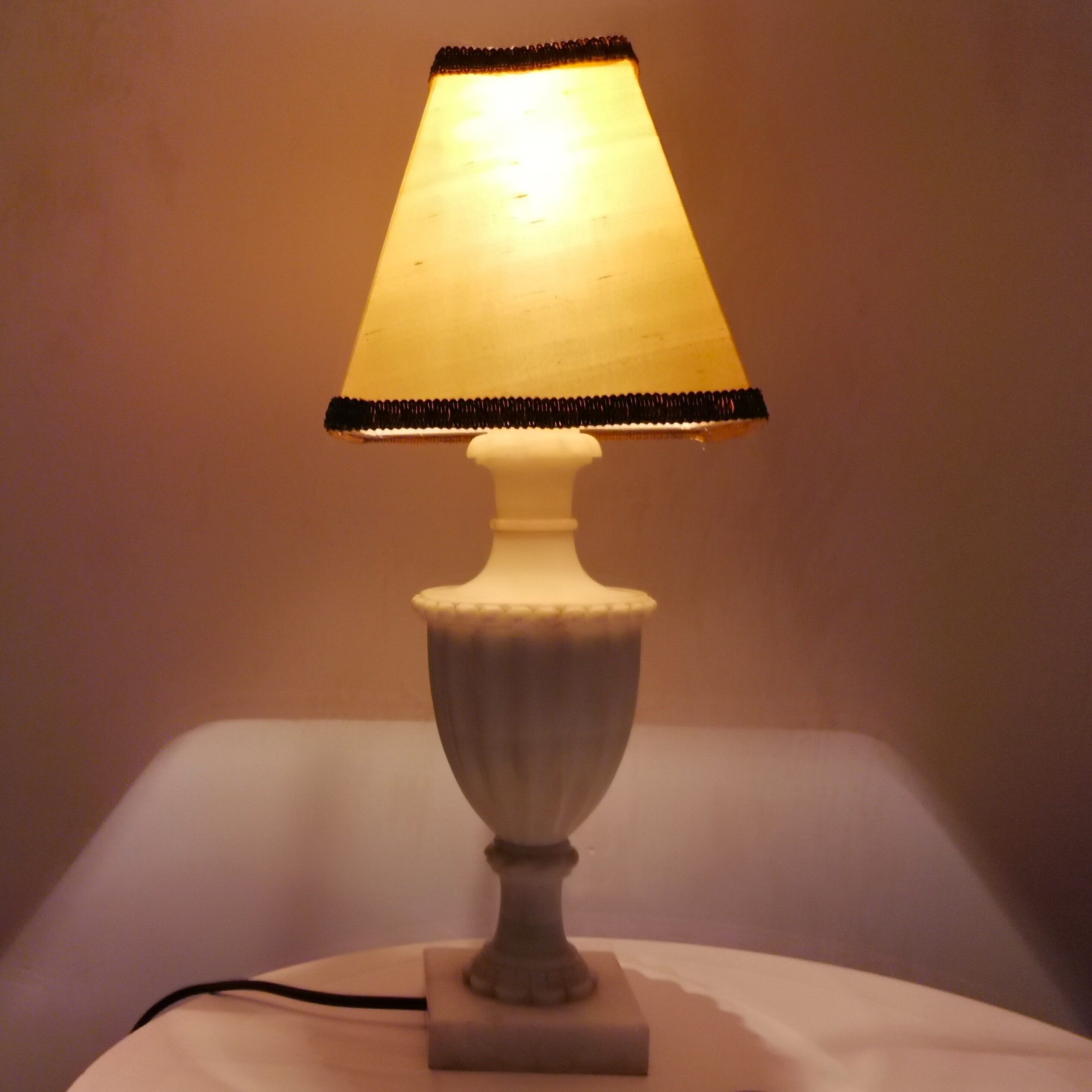 White marble amphora shaped table lamp