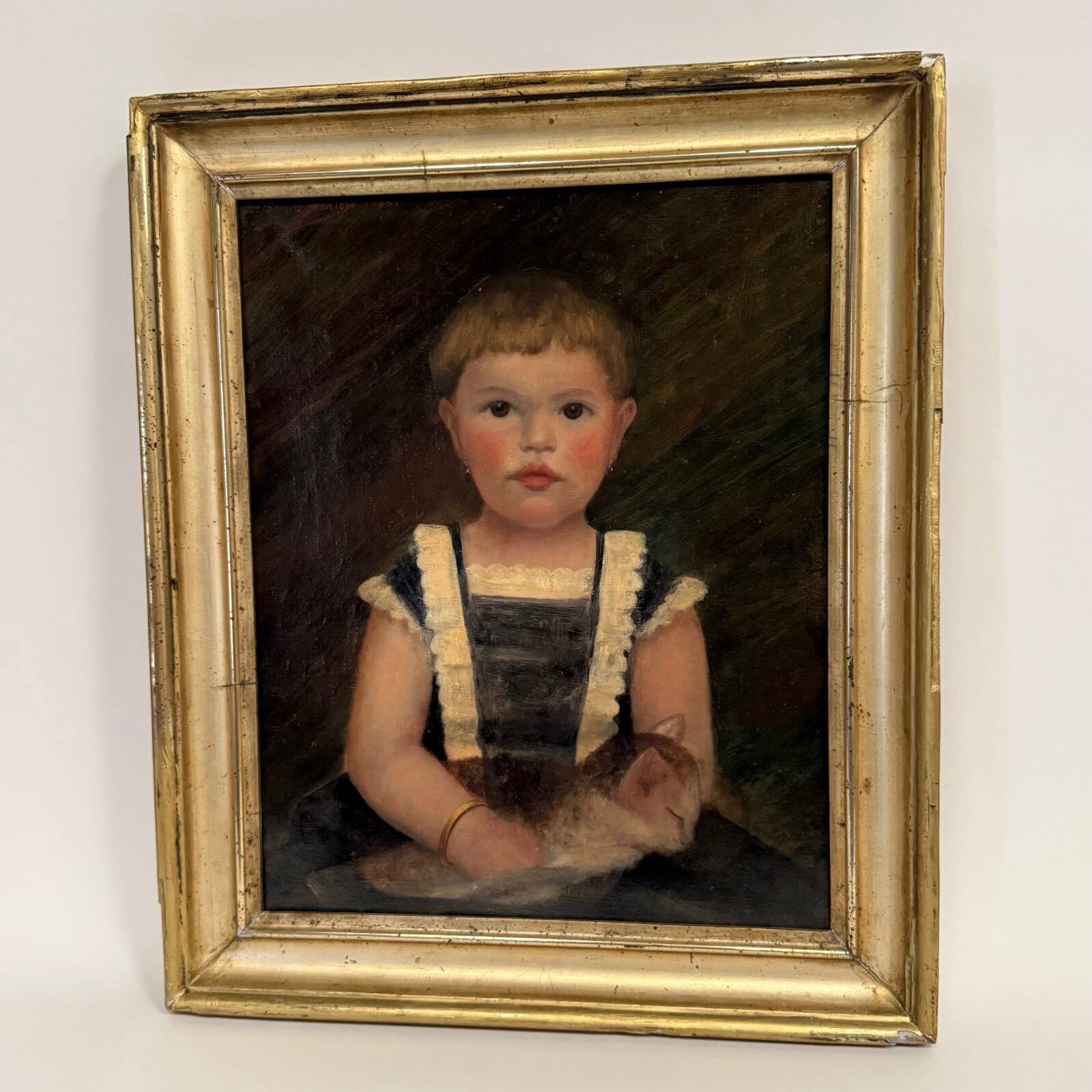 Oil on canvas 19th century young child carrying his cat gilded frame