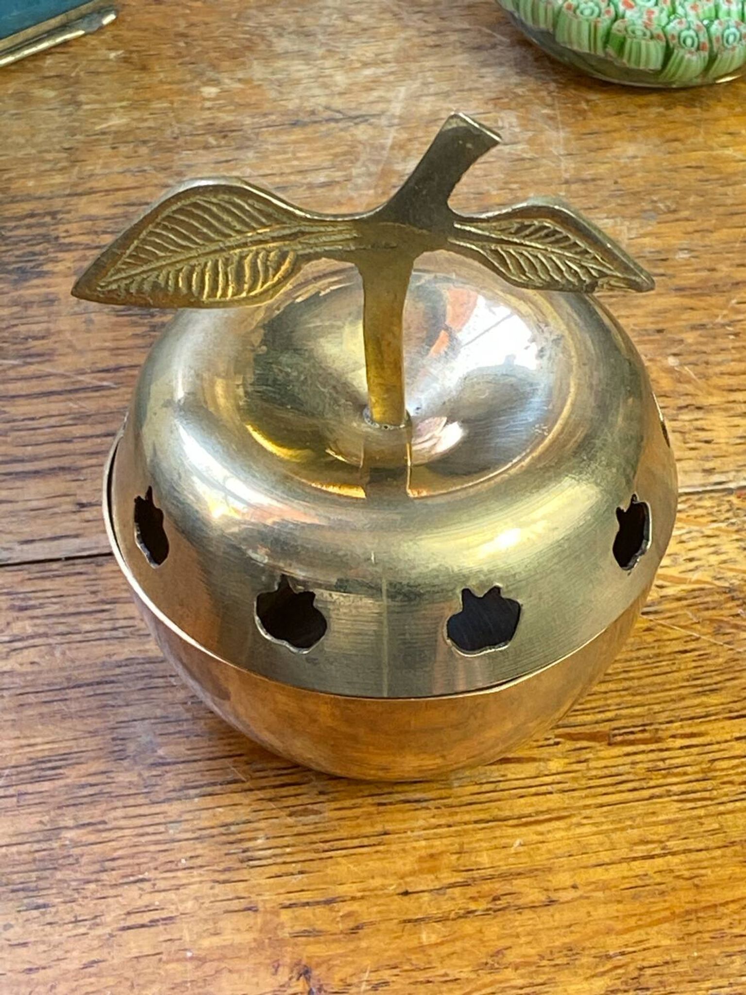 Bonbonnière, in the shape of an apple, made of brass.