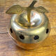 Bonbonnière, in the shape of an apple, made of brass.