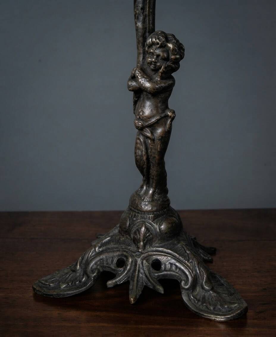 Antique bronze chandelier with putto, 19th century.