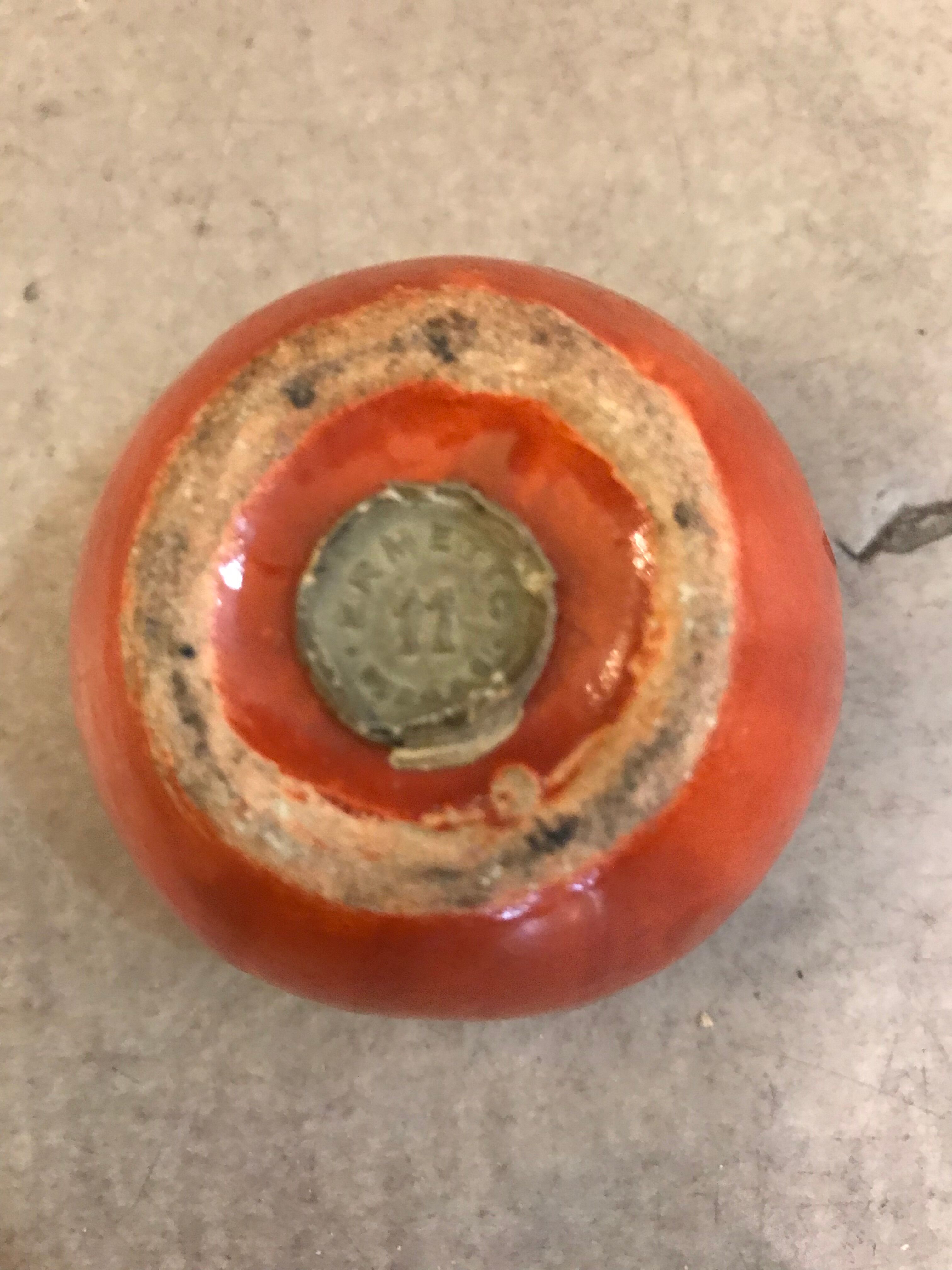 Vintage salt shaker in the shape of an orange marked ermetic