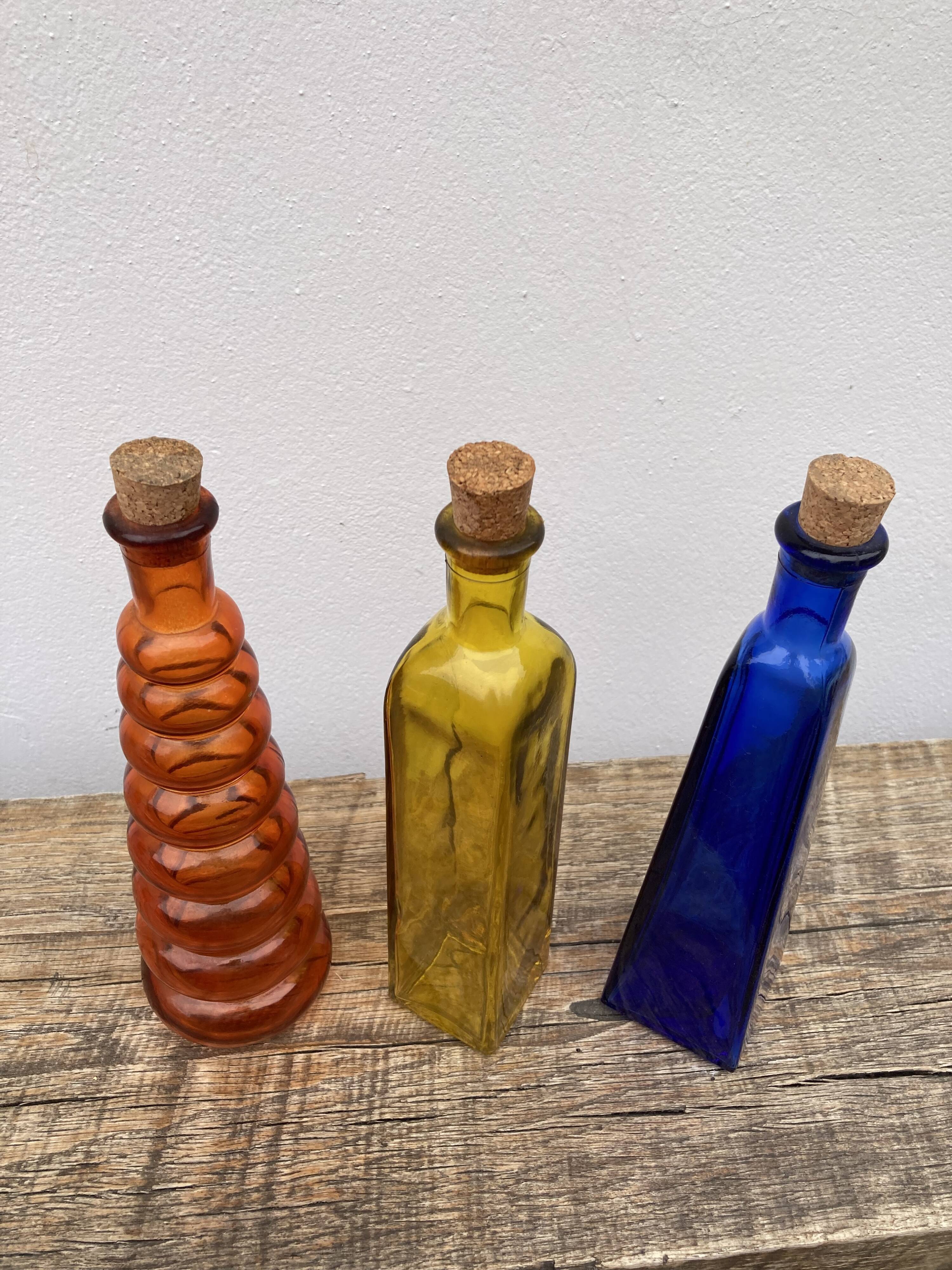 Trio of bottles 1970 color orange yellow and blue geometric shape