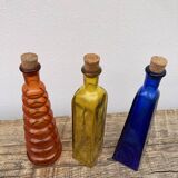 Trio of bottles 1970 color orange yellow and blue geometric shape