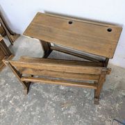 Double school desk and its wooden bench