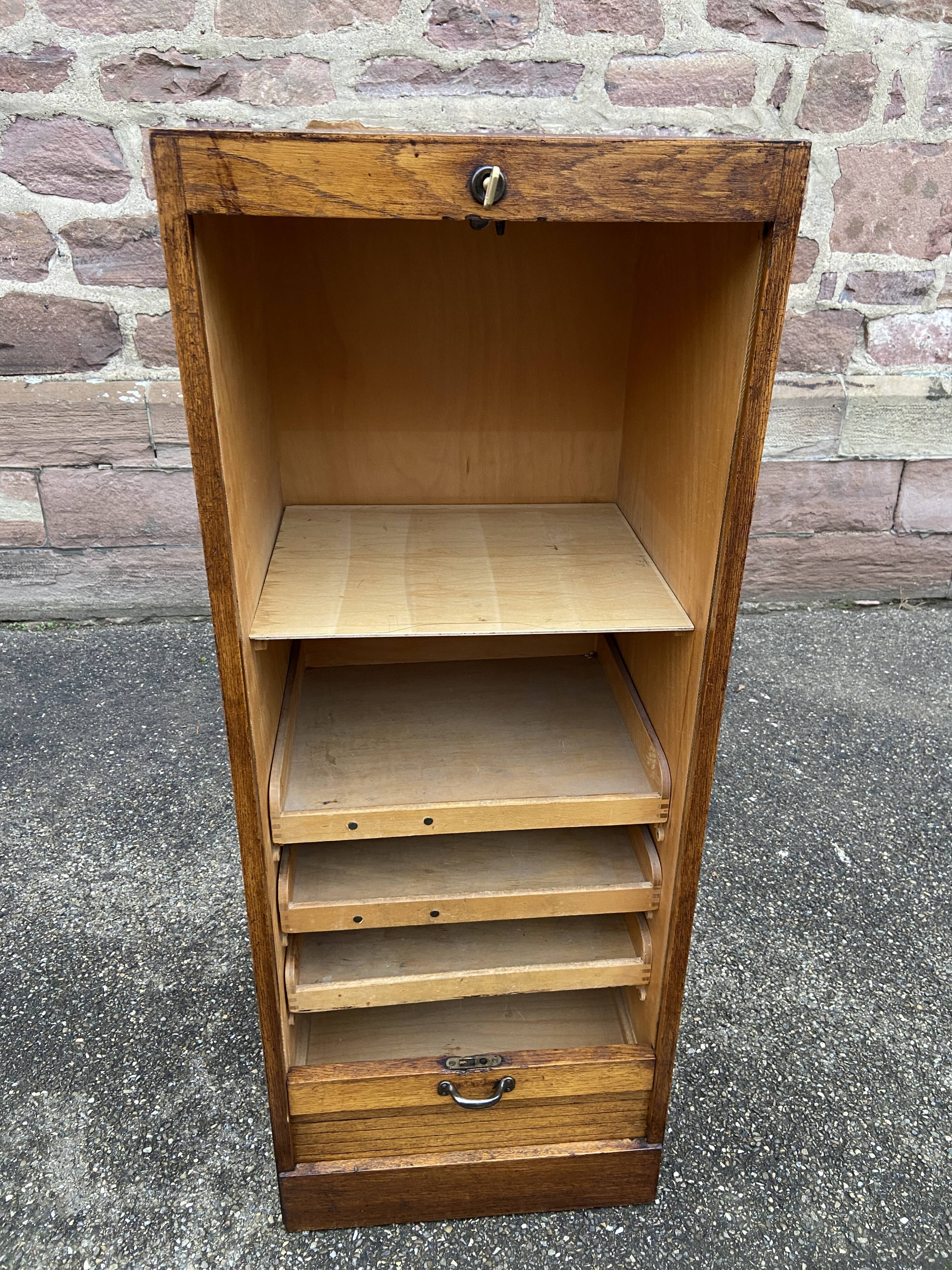 Sliding curtain binder cabinet