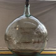 Former green glass demijohn