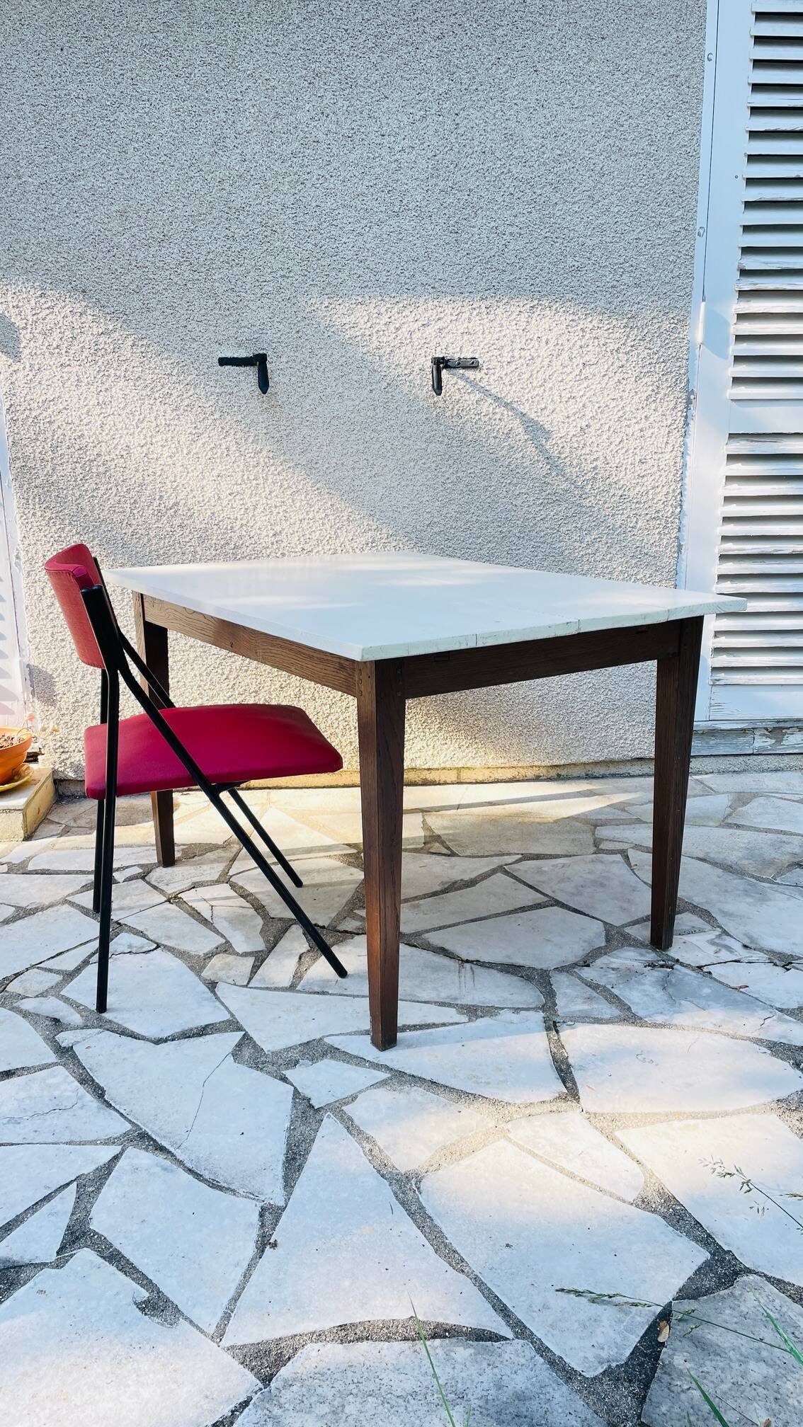 Vintage oak farmhouse table with a white top.
