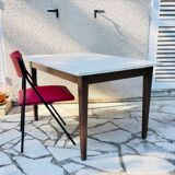Vintage oak farmhouse table with a white top.