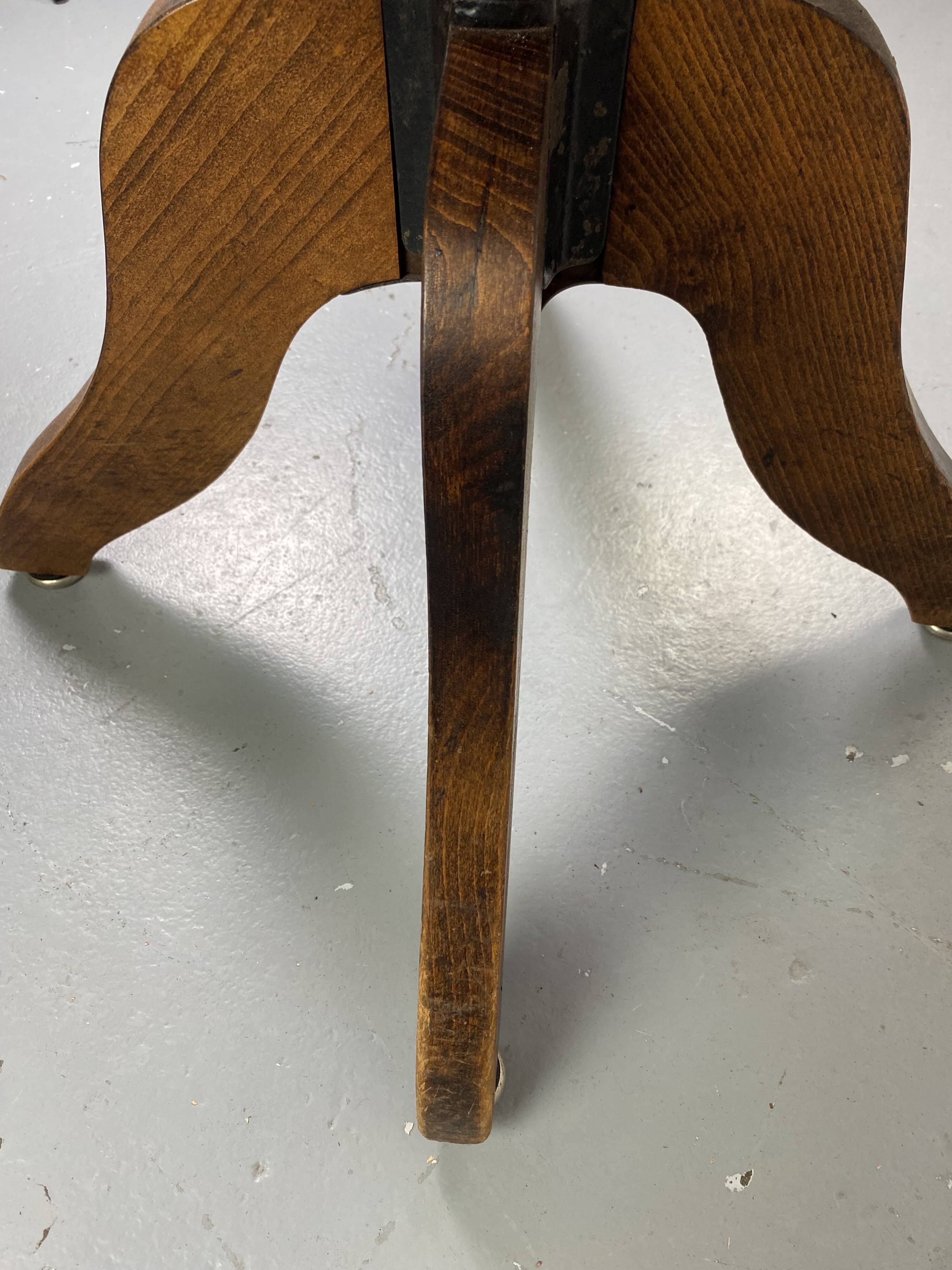 Baumann rotating wooden armchair