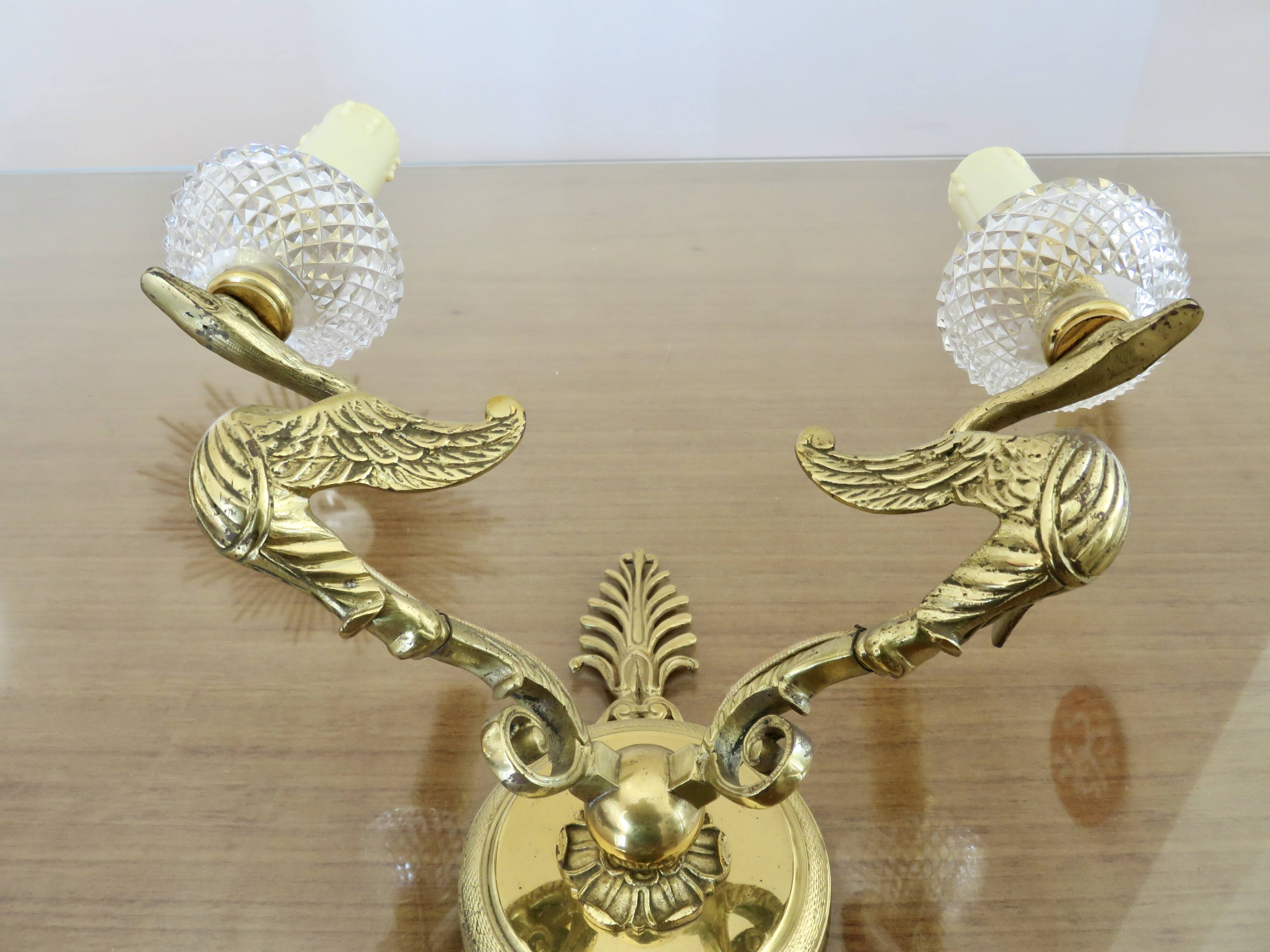 Pair of Lucien Gau "swan" wall lights in gilded bronze with bright gold and crystal