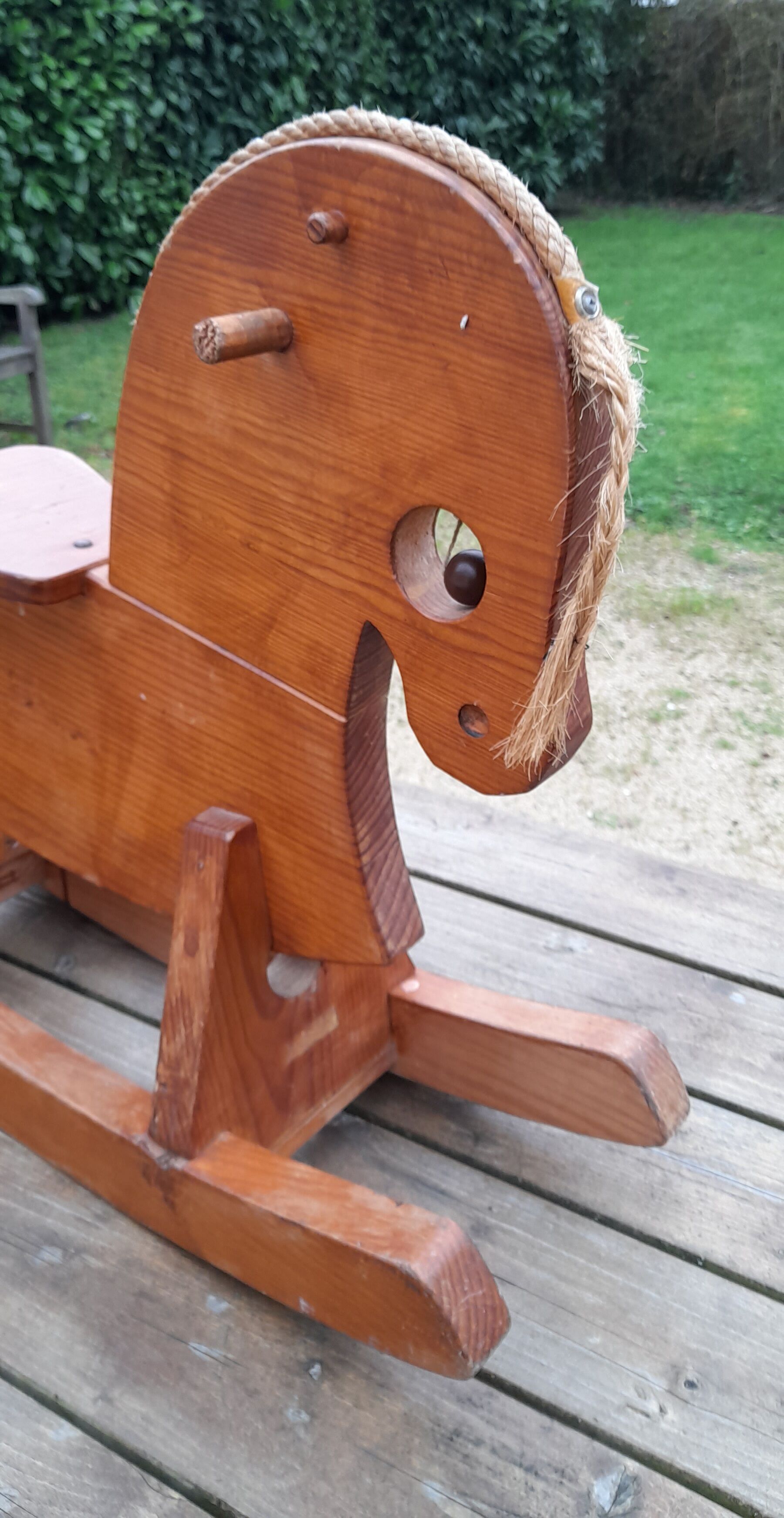 Rocking horse in raw and glazed wood