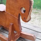 Rocking horse in raw and glazed wood