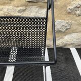 Black perforated metal magazine rack