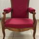 Antique Louis Philippe armchair in walnut and red fabric.