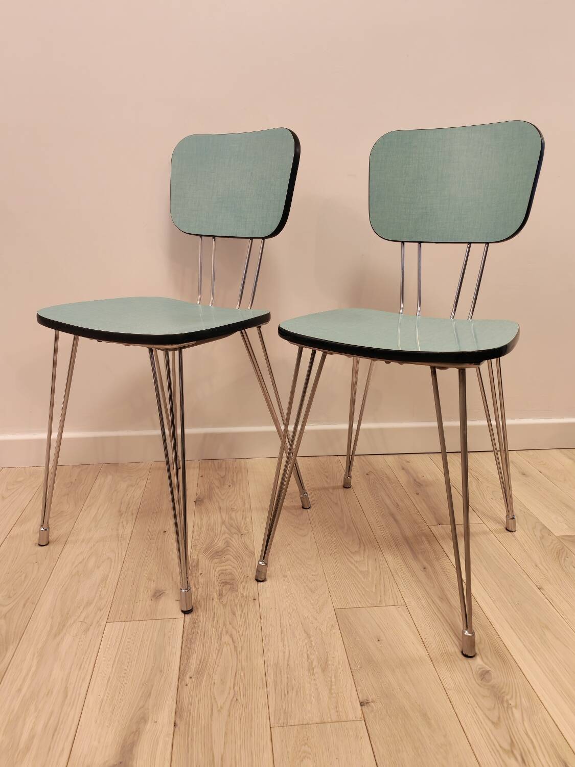 Pair of green Formica chairs with Eiffel legs
