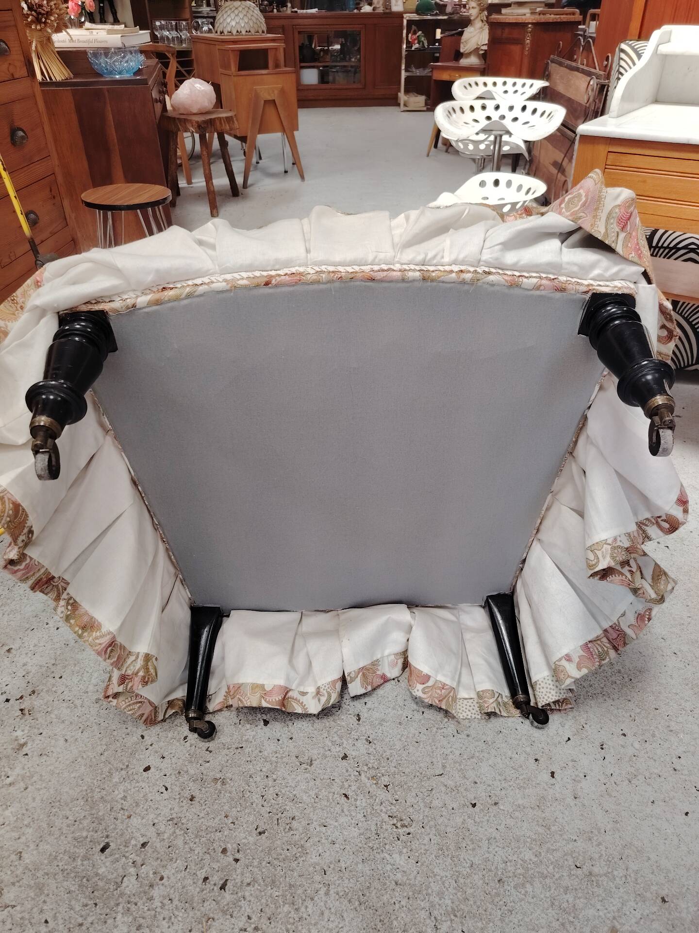 Antique armchair fully restored with brass wheels.