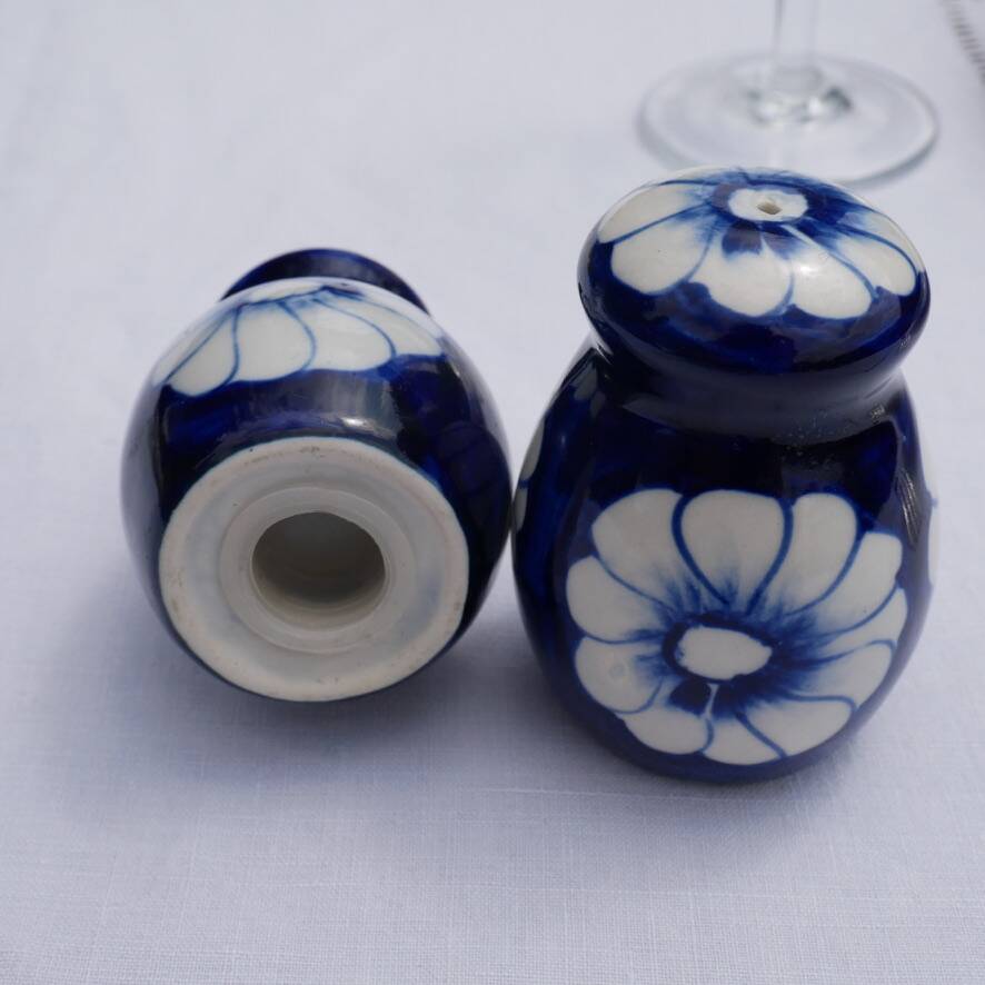Blue ceramic salt and pepper shaker with flower pattern