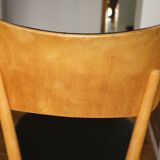 5 baumann chairs with large backs in black faux leather.