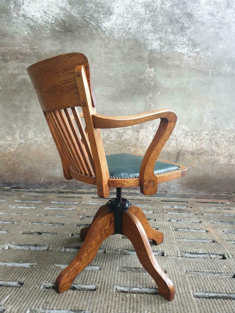 Antique office chair oak adjustable with green leather