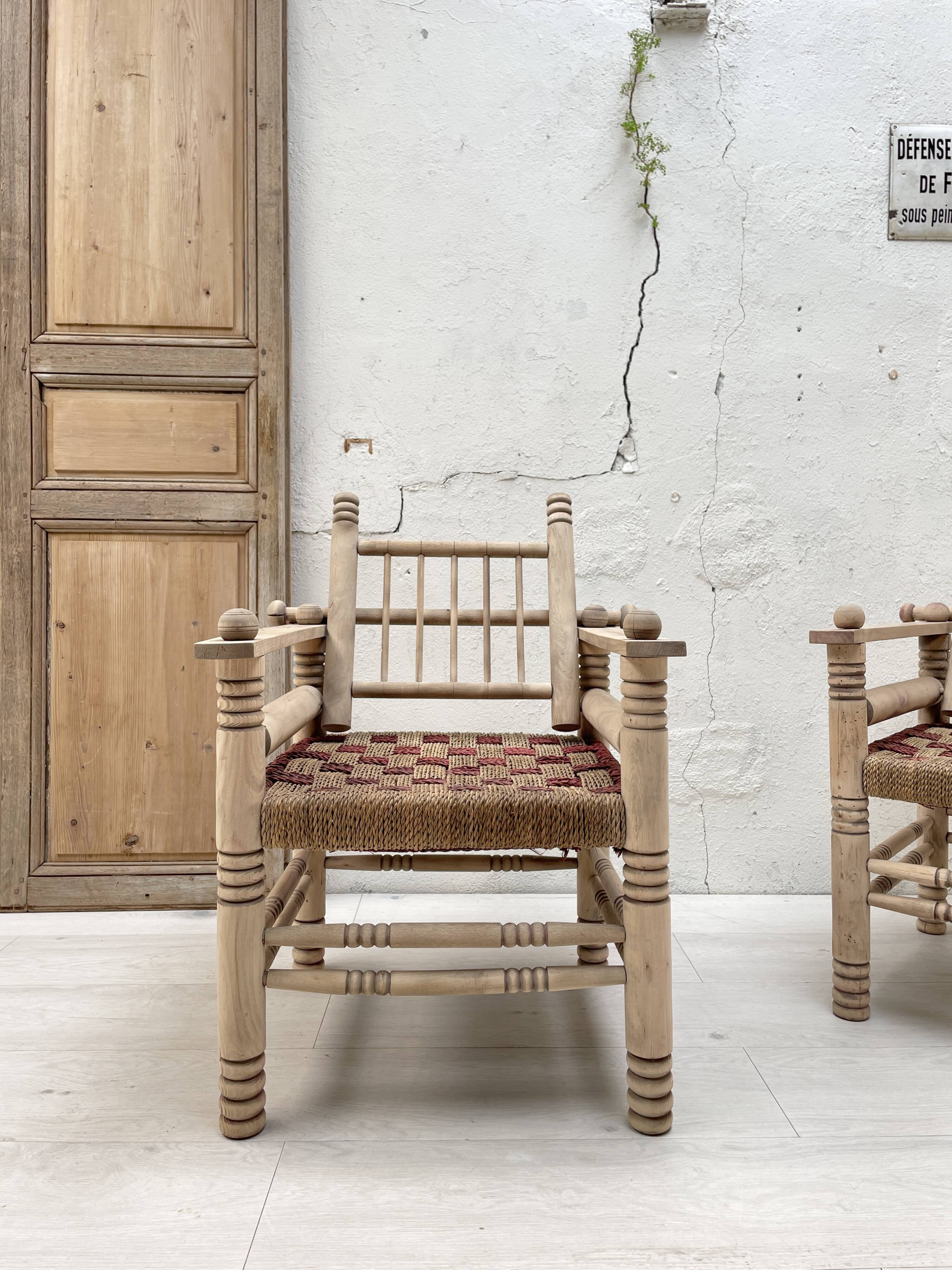 Pair of wooden armchairs and ropes