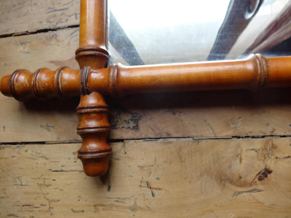 Mirror to the wooden frame imitating bamboo