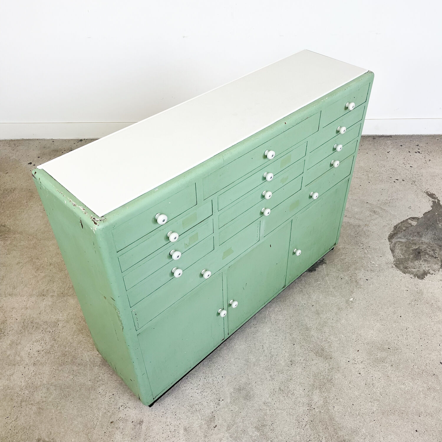 Vintage mint green dentist drawer unit with opaline glass top