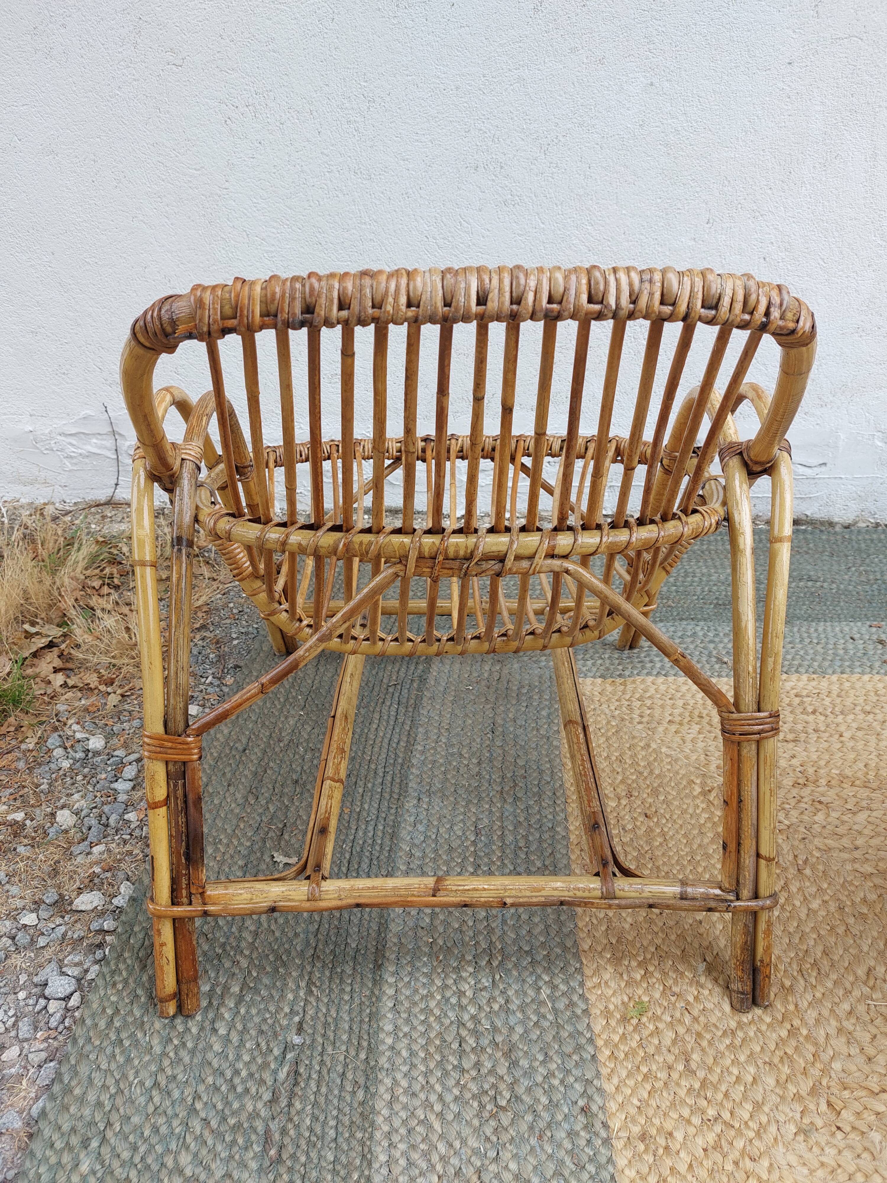 4 armchairs and a coffee table made of rattan and bamboo wood, vintage.